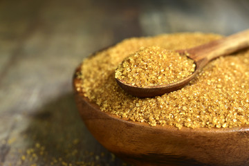 Brown sugar in a wooden bowl.