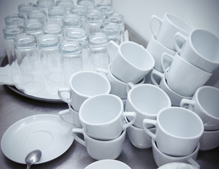 Cups and glasses on a restaurant kitchen. Selective focus. Shall