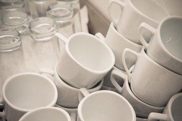 Obraz na płótnie Canvas Cups and glasses on a restaurant kitchen. Selective focus. Shall