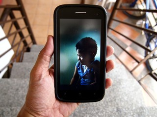 Photo of a kid displayed on a smartphone