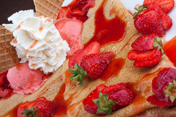 Crepes with strawberries and cream