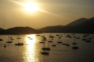 Sunrise Over Ships in Harbor