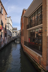 Venice, Italy, June, 21, 2016: landscape with the image of boats on a channel in Venice, Italy