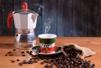 Coffee pot and cup with tricolor aromatic coffee
