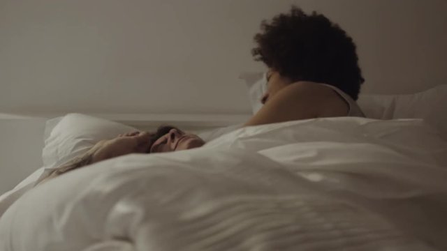Mixed Race Couple romantic in bed