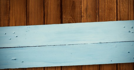 Composite image of painted blue wooden planks