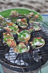 Grilling shellfish and seafood on hot fire