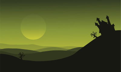 Obraz premium Halloween castle silhouette on green backgrounds
