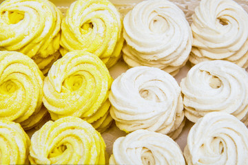 Obraz na płótnie Canvas Background of delicious marshmallows white and yellow colors