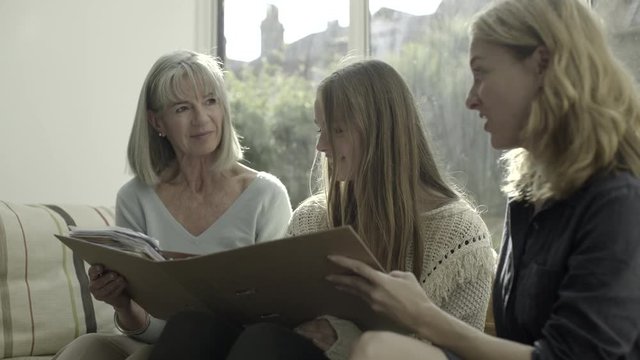 Three generation family sitting on sofa