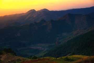 Fototapeta premium Mountain and hill tribe village at sunset in Thailand.