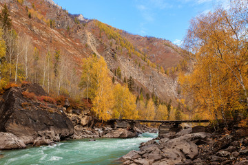 mountain river with the wooden bridge