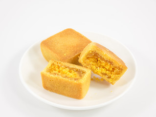 The tasty Taiwanese pineapple pastry cake on the small white square dish.