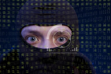 Hacker with balaclava over a screen with binary code