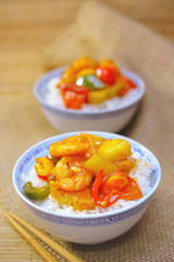 sweet and sour shrimp. deep fried crispy prawn stir fried with pineapple and fresh capsicum in sour and sweet sauce. worldwide famous chinese cuisine.