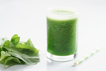 glass of fresh green spinach healthy smoothie