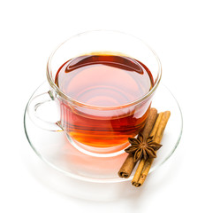 Transparent cup of tea and cinnamon steaks on white