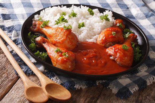 Thai dish: chicken with chilli sauce Sriracha and Rice close-up. horizontal
