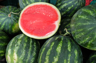 Half sliced watermelon wrapped protective film..sold at local fa © vadiml