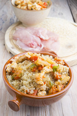 High-key image of white plate with quinoa lentil salad and bowl