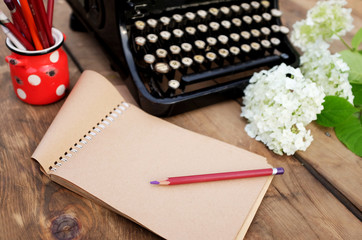 old typewriter with Russian letters on a wooden background