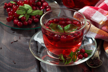 berry tea in cup on wooden table