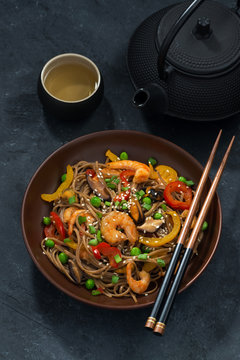 Asian lunch. Buckwheat noodles with seafood and vegetables