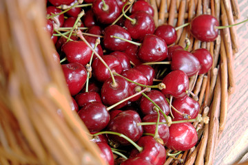 Ripe cherries in a wicker basket