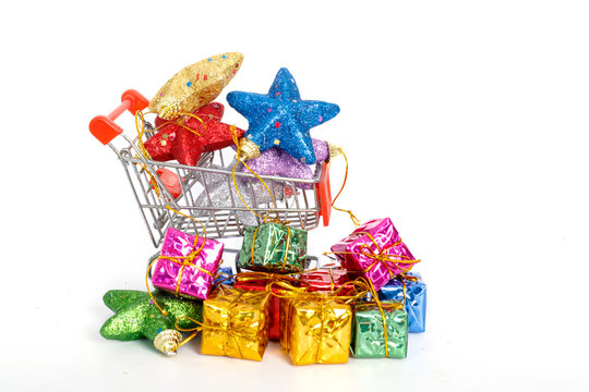 colorful gifts box in supermarket shopping cart,concept of buy s