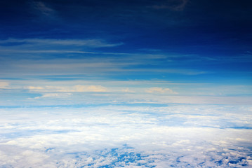 Naklejka na ściany i meble deep blue sky with clouds, a view from airplane window