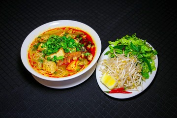Bun Rieu or Vietnamese vermicelli noodle soup with milled crab meat