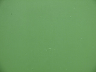 Seamless green painted concrete wall background