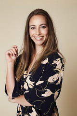 Gorgeous girl in kimono smiling at camera