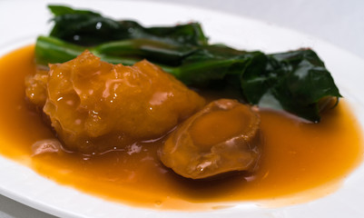 Abalones. Chinese cuisine abalone on the background.
