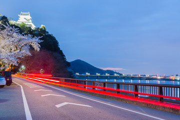 light trail on road in night at inuyama castle