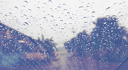 raindrops on windshield on road