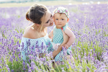 Mother with baby girl in lavender field