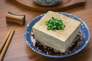 Tofu with soy sauce and sesame on plate