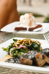 Beef meat and black sauce with beans