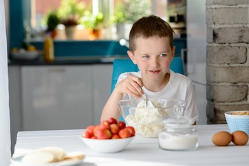Child mixing white cottage cheese in a bowl