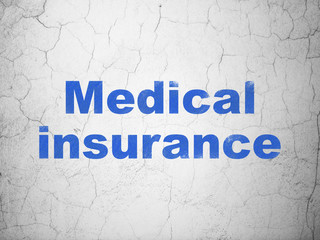 Fototapeta premium Insurance concept: Medical Insurance on wall background