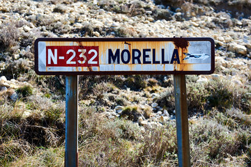 Obraz premium Old road sign of Morrela village. Spain