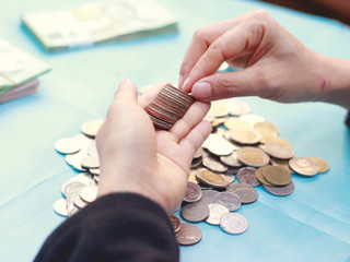 Asian woman counting money