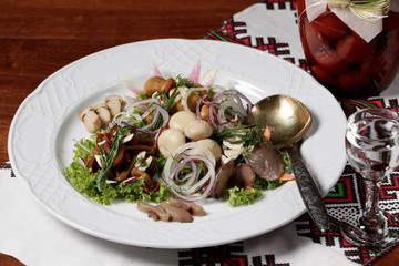 Assorted pickled mushrooms on the plate