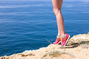 Woman fitness jog workout wellness concept. Girl runner legs and