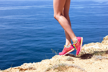 Woman fitness jog workout wellness concept. Girl runner legs and