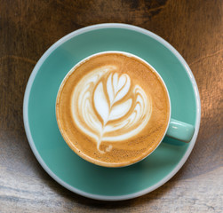 Top angle view of coffee cup on wood background
