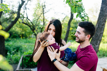 young family with a child on the nature