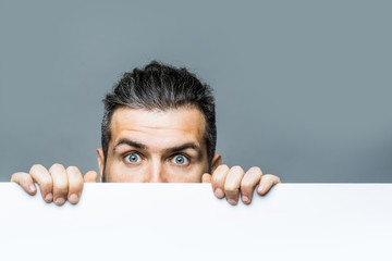 scared man with paper