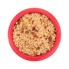 Small dish filled with salt, red chili pepper and paprika top view isolated on a white background.